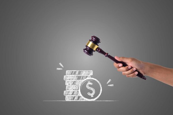 hand-that-holds-hammer-piles-money-written-with-white-chalk-draw-concept_optimized_1024x682